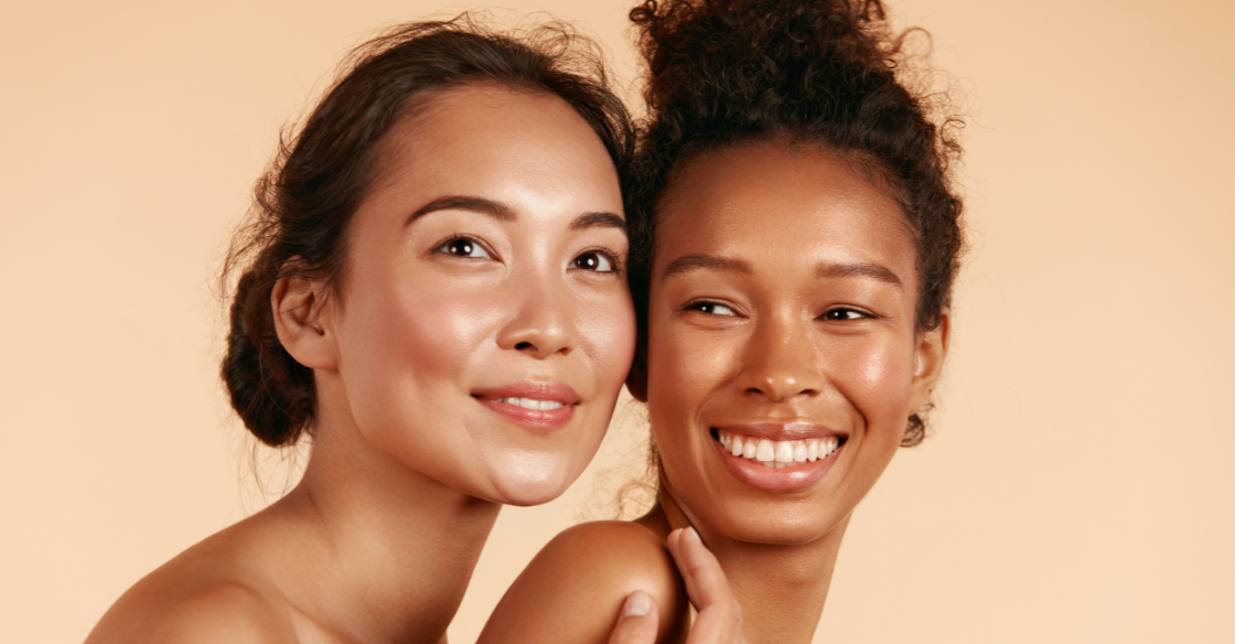Two happy women with healthy skin
