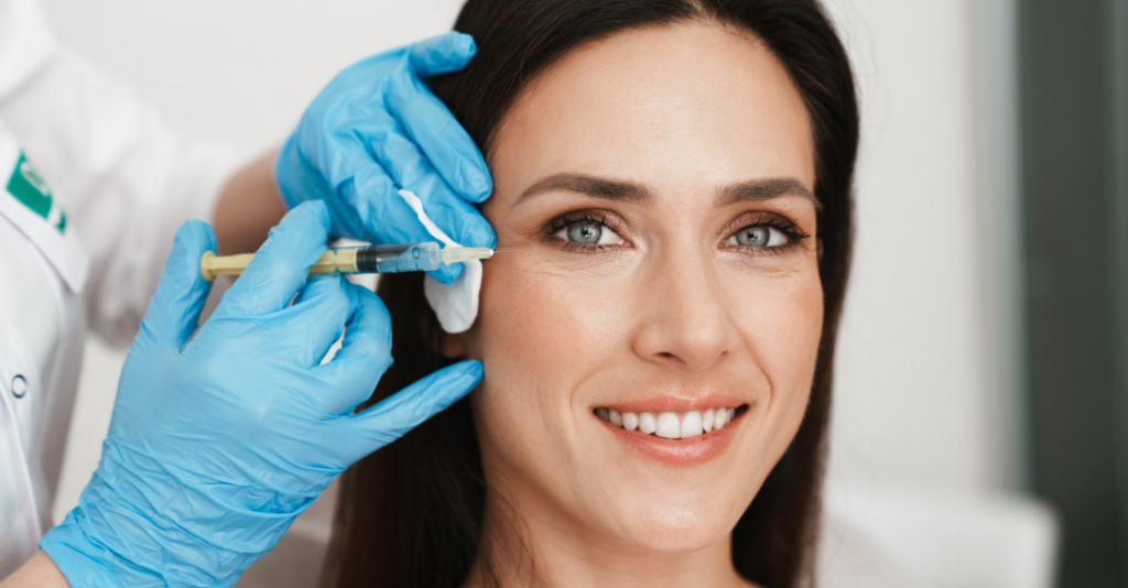 Woman getting Botox injections in her Crow's feet